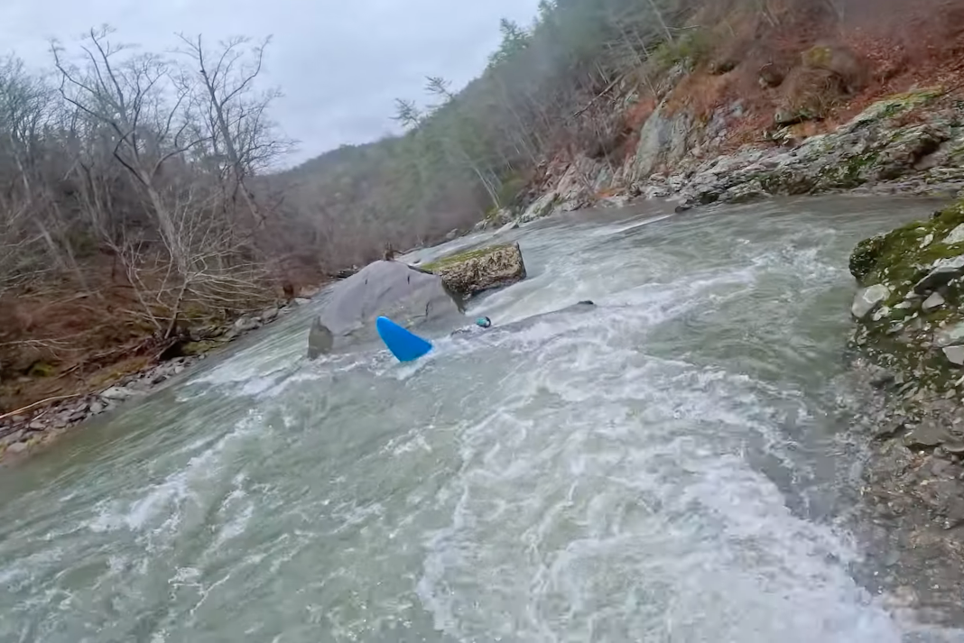 Kayaker pinned beneath a strainer on the Big Laurel. Image: SUPPaul // YouTube